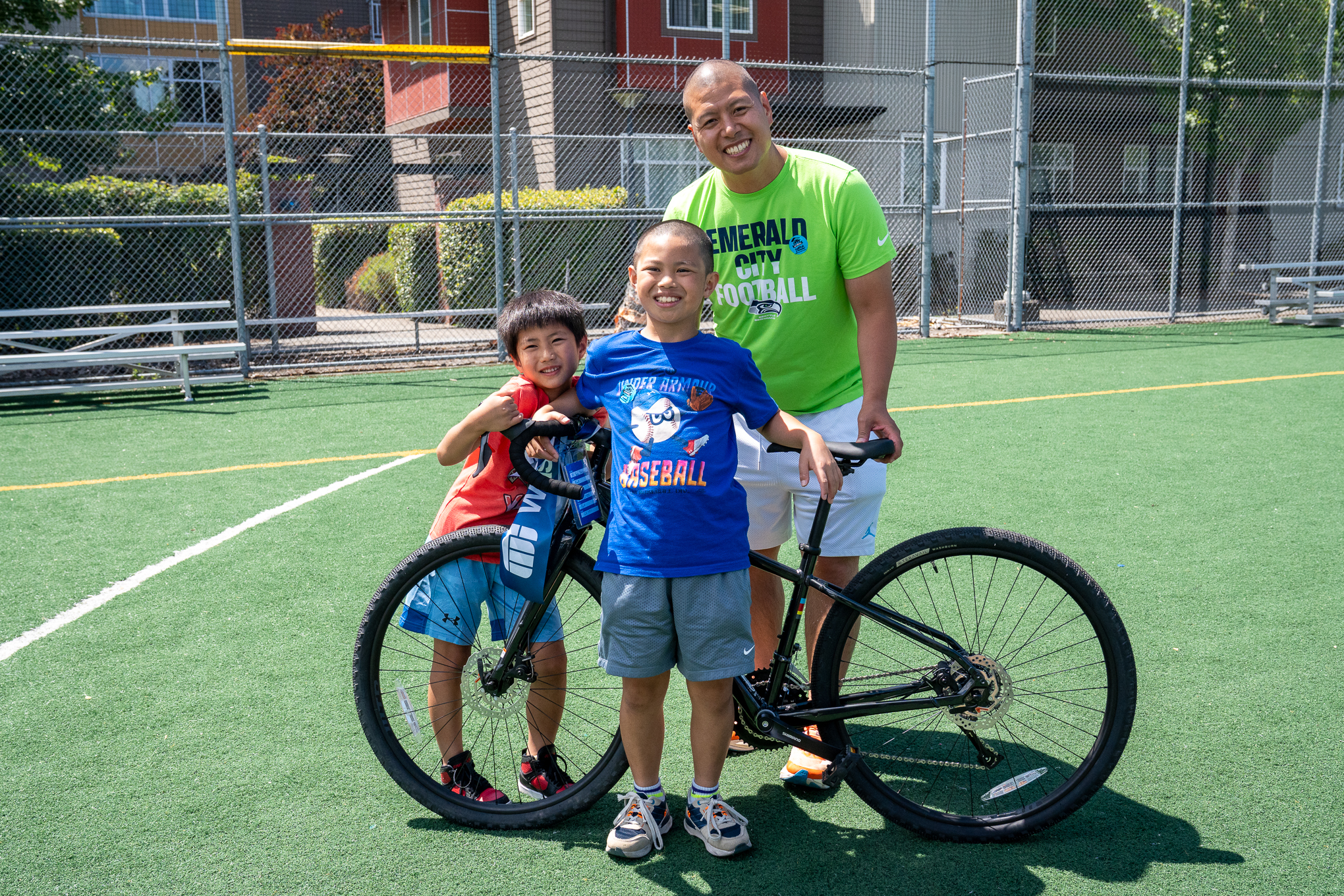 Washington Trust bike giveaway at Habitat for Humanity Liberty Commons block party dedication.