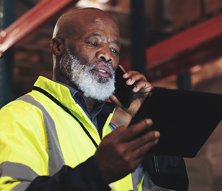 Employee using mobile technology, representing secure wireless networking for businesses.