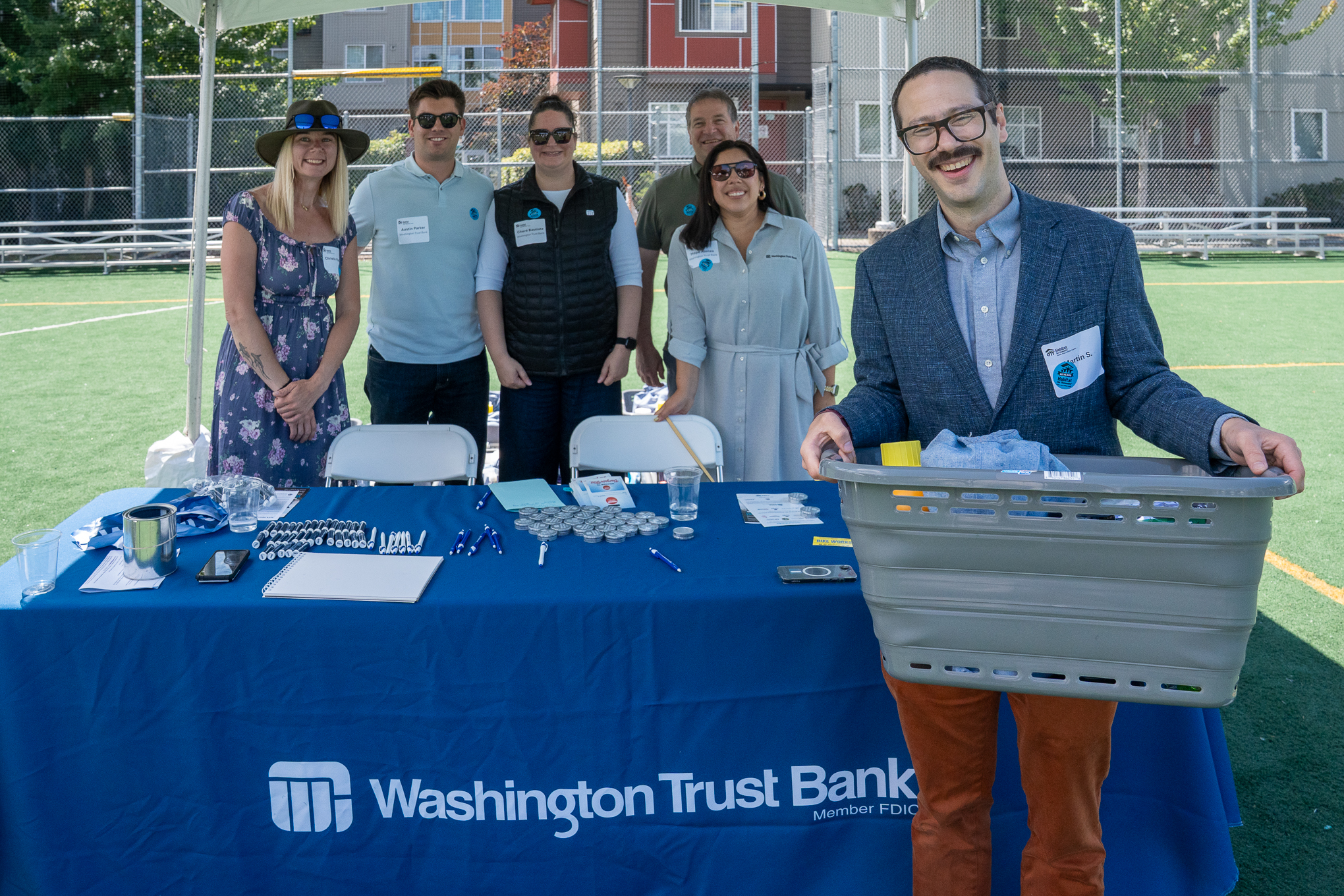 Washington Trust cleaning supply giveaway at Habitat for Humanity Liberty Commons block party dedication.